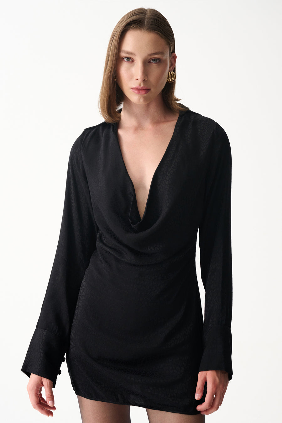 Black satin mini draped neckline dress with subtle jacquard texture, long sleeves and deep V front